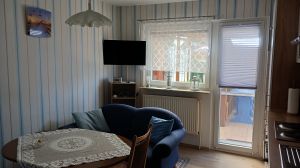 Wohnküche mit gemütlicher Sitzecke - Bild 5: Ferienwohnung in der Nähe der ostfriesichen Nordseeküste